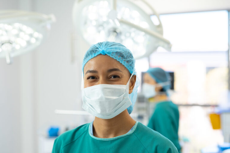 Surgeon in operating room attire.