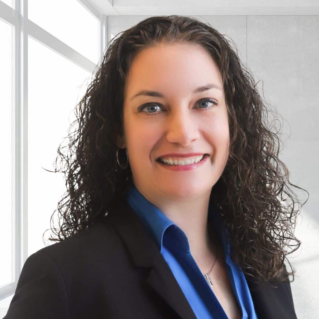 Person in professional attire, indoors.