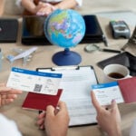 Travel preparations with tickets and passports.