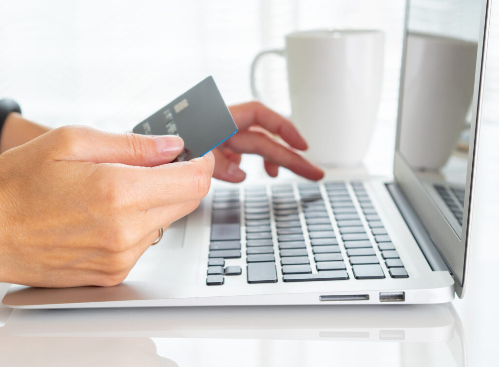 Person shopping online with credit card