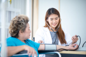 Medical professional checking blood pressure