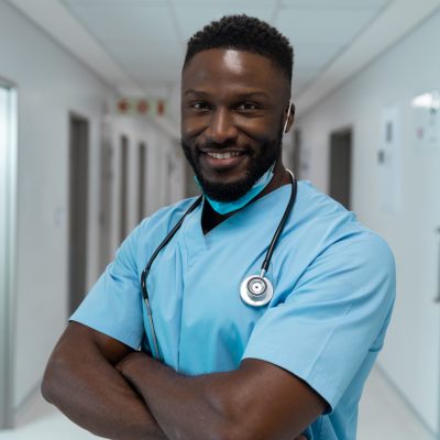 Doctor in scrubs with stethoscope.
